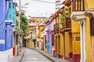 Colorful colonial streets in Cartagena's Walled City with balconies overflowing with flowers