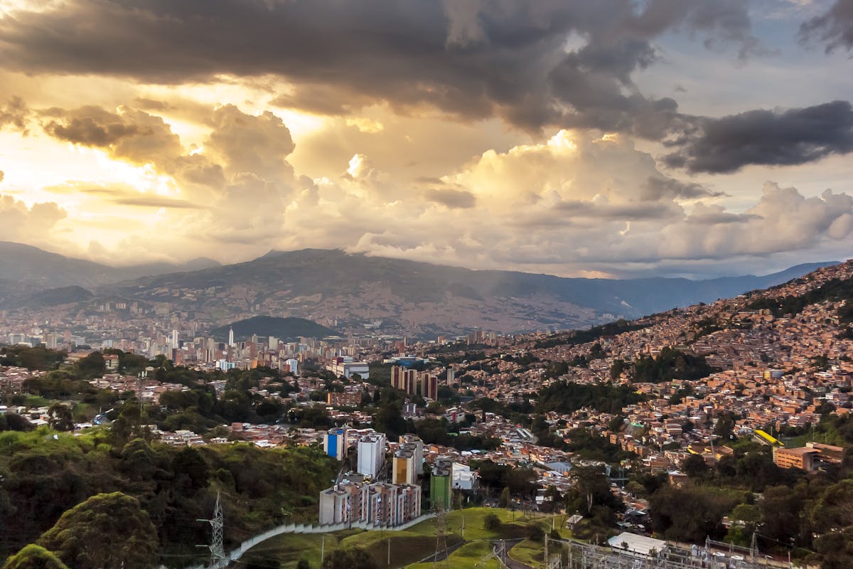 Medellin Colombia skyline at sunset — digital nomad visa guide